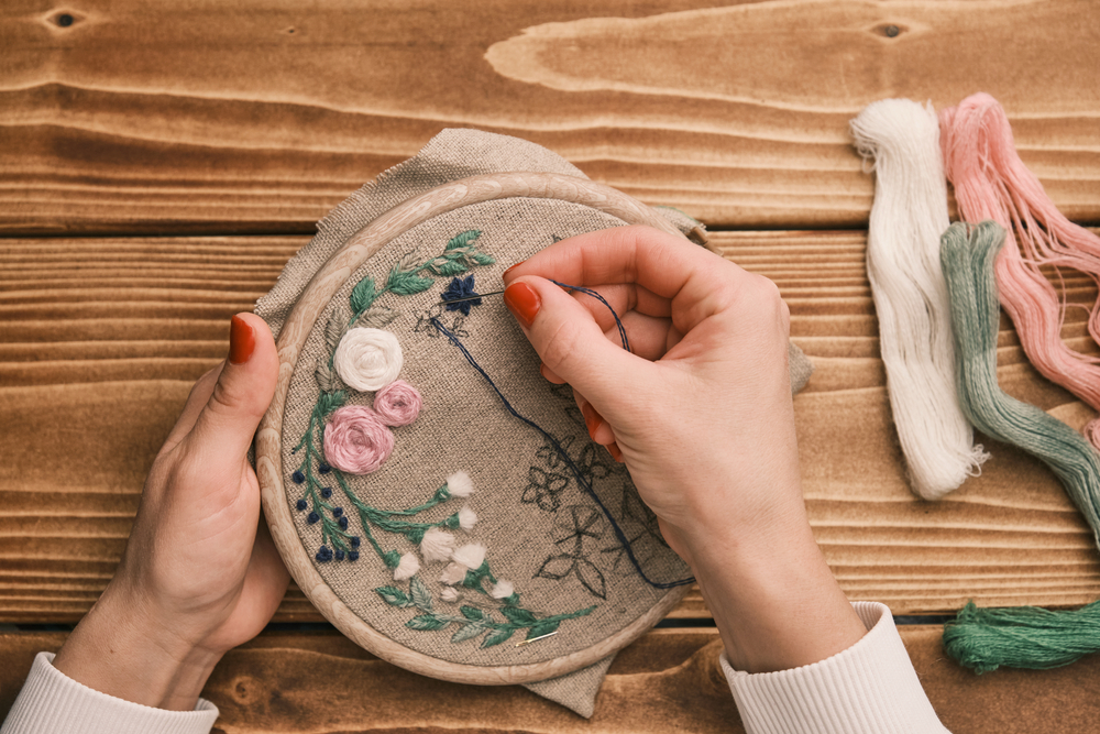 woman's hand is embroidered with tribal native fabric